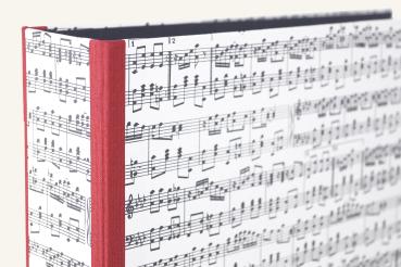 Folder with music motif with red edges and mechanism